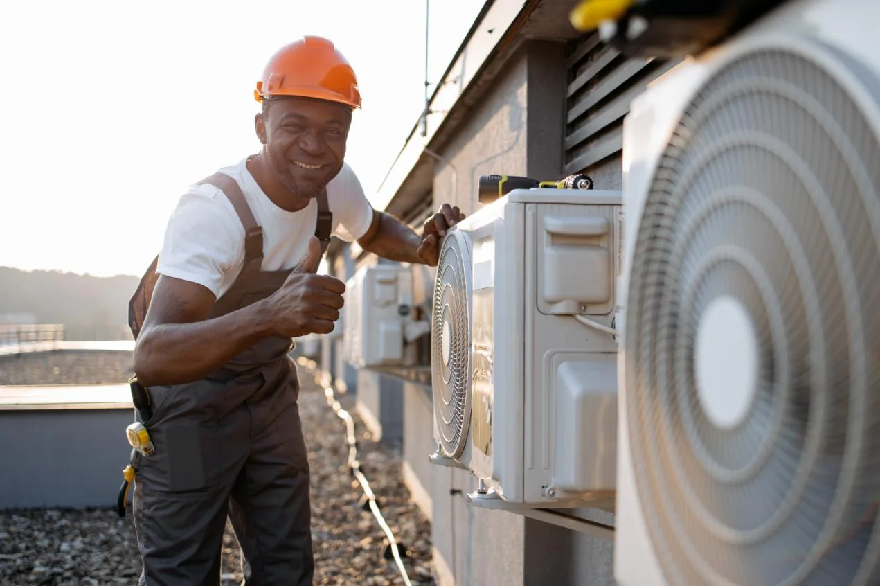 Generic service model beside rooftop air-conditioning equipment during an HVAC inspection
