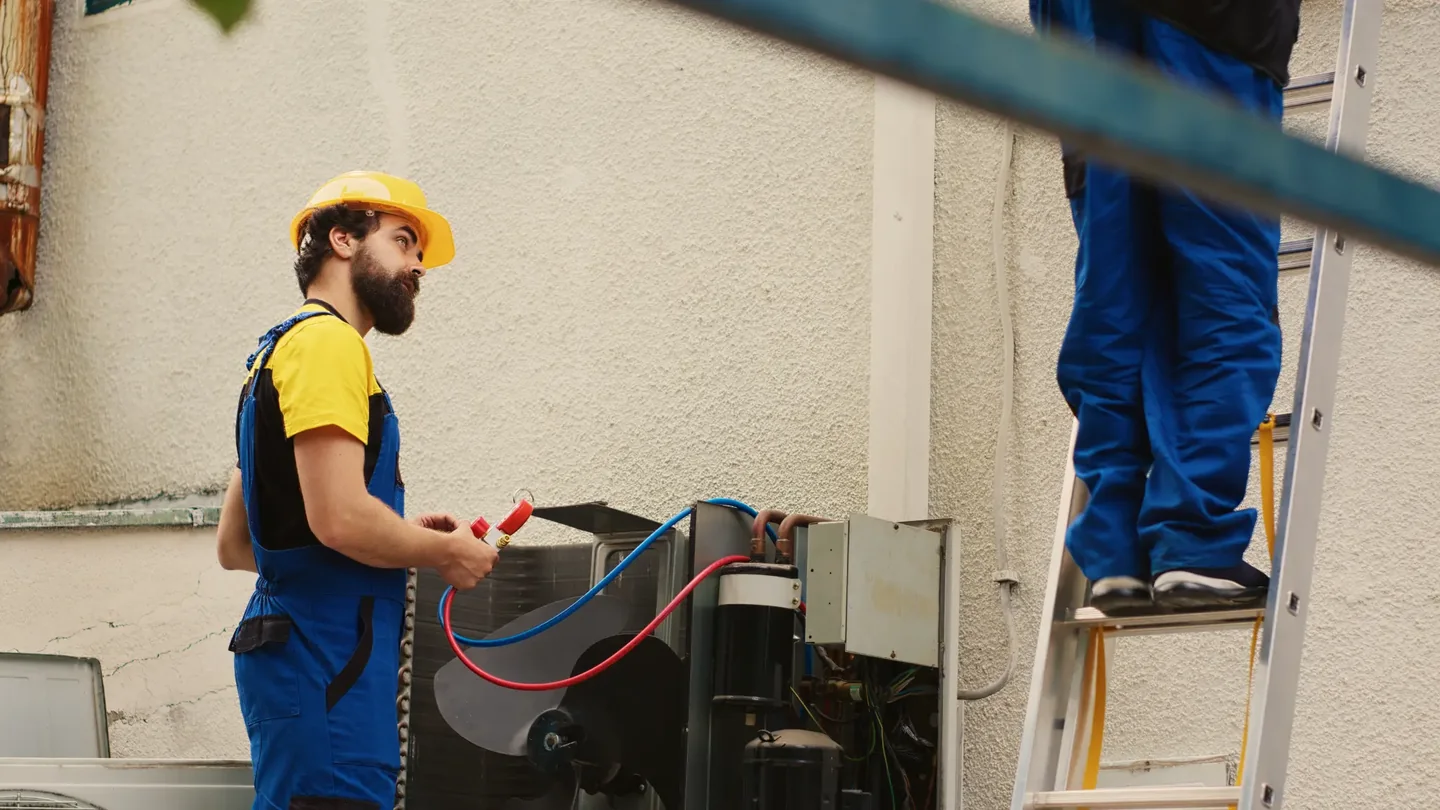 Two generic service models inspect an outdoor HVAC condenser using service hoses and a ladder